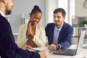 A young couple get approved for a mortgage