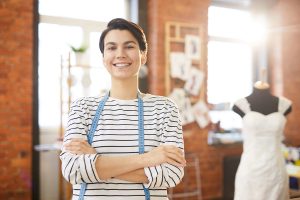 A self-employed dress maker